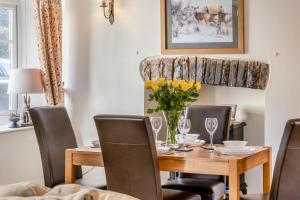 a dining room with a wooden table and chairs at 2 Bed in Trecastle oc-c30837 in Trecastle +31 photos