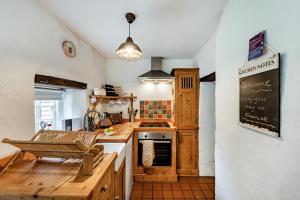 a kitchen with a chalkboard on the wall at 2 Bed in Broadwoodkelly oc-j31818 in Broadwoodkelly