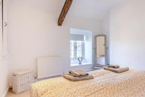 a bedroom with a bed with two towels on it at 1 Bed in Harlech oc-t32043 in Harlech