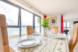 a dining room with a table with plates and glasses at 3 Bed in Hythe oc-s32090 in Hythe