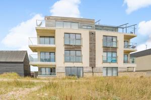 an apartment building on top of a hill at 3 Bed in Hythe oc-s32090 in Hythe