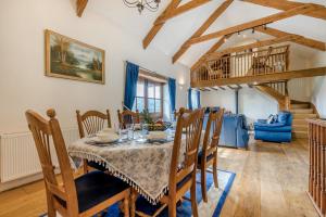 a dining room with a table and chairs at 3 Bed in Woodford oc-w32062 in Kilkhampton