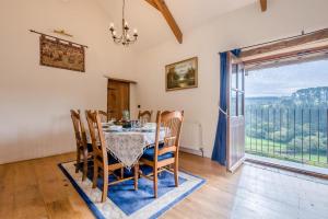 a dining room with a table and chairs and a window at 3 Bed in Woodford oc-w32062 in Kilkhampton +14 photos