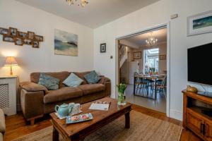 a living room with a couch and a table at 2 Bed in Wimborne oc-s30924 in Wimborne Minster