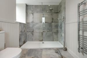 a bathroom with a shower and a toilet at 5 Bed in Cyffylliog oc-c32596 in Cyffylliog +61 photos