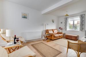 a living room with a couch and a chair at 1 Bed in Seahouses oc-gd1735 in Seahouses
