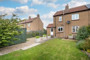 an exterior view of a house with a yard at 1 Bed in Seahouses oc-gd1735 in Seahouses