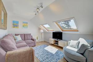a living room with a couch and a tv at 2 Bed in Crackington Haven oc-p00596 in Crackington Haven