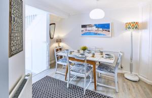 a dining room with a white table and chairs at 2 Bed in St. Ives oc-p00693 in Carbis Bay