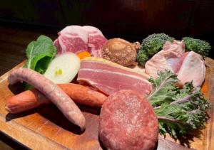 a bunch of different types of vegetables on a cutting board at glampark Verga in Hokuto