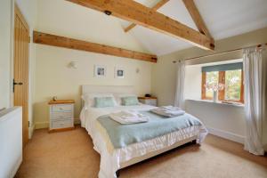 a bedroom with a bed and a window at 3 Bed in Thursford oc-1793 in Thursford
