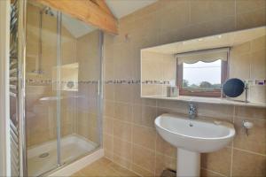 a bathroom with a sink and a shower at 3 Bed in Thursford oc-1793 in Thursford +18 photos