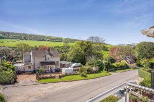 an aerial view of a house with a driveway at 3 Bed in West Lulworth oc-h29362 in West Lulworth