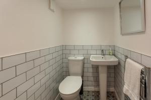 a bathroom with a toilet and a sink at 3 Bed in West Lulworth oc-h29362 in West Lulworth +8 photos