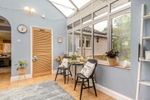 a room with a table and chairs and a window at 1 Bed in North Walsham oc-f29380 in North Walsham