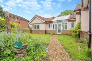a house with a garden in front of it at 1 Bed in North Walsham oc-f29380 in North Walsham