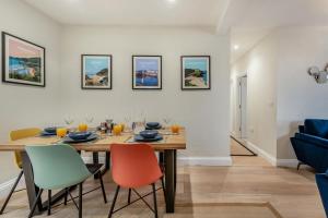 a dining room with a wooden table and chairs at 3 Bed in New Quay oc-c29640 in New Quay +12 photos