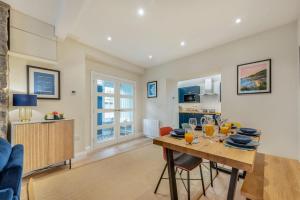 a kitchen and living room with a table and chairs at 3 Bed in New Quay oc-c29640 in New Quay