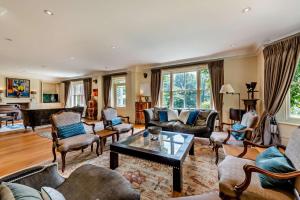 a living room with couches and a table at 6 Bed in Robertsbridge oc-d29525 in Brightling