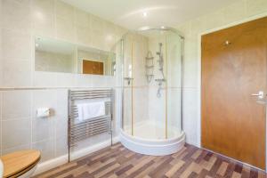 a bathroom with a shower and a bath tub at 3 Bed in Hawes oc-s30429 in Hawes +22 photos