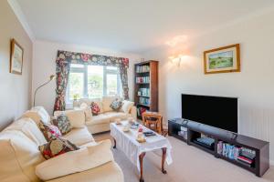 a living room with a couch and a flat screen tv at 3 Bed in Hawes oc-s30429 in Hawes
