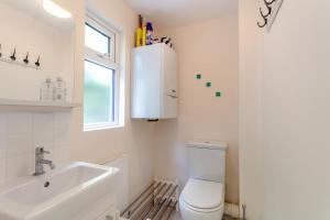 a white bathroom with a toilet and a sink at 3 Bed in Beer oc-b31132 in Beer +19 photos