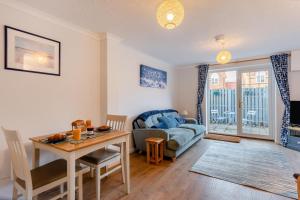a living room with a table and a couch at 2 Bed in Snettisham oc-d31668 in Snettisham