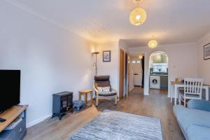a living room with a couch and a dining room at 2 Bed in Snettisham oc-d31668 in Snettisham