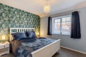 a bedroom with a bed and a window at 2 Bed in Snettisham oc-d31668 in Snettisham