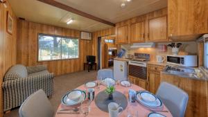 a dining room with a table in a kitchen at BIG4 Barham Holiday Park in Barham