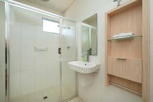 a bathroom with a glass shower and a sink at Apt 9 'Delphinius' @ Bay View Centro, Dunsborough in Dunsborough +14 photos