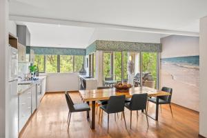 a kitchen and dining room with a table and chairs at Apt 9 'Delphinius' @ Bay View Centro, Dunsborough in Dunsborough