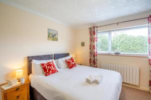 a bedroom with a bed with two shoes on it at 2 Bed in Abersoch oc-c31969 in Abersoch