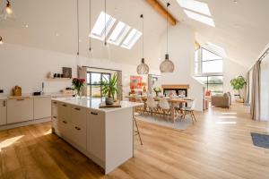 an open kitchen and dining room with skylights at 4 Bed in Rattray oc-e31983 in Alyth