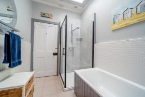 a bathroom with a shower and a bath tub at 2 Bed in Moffat oc-a32121 in Moffat +13 photos