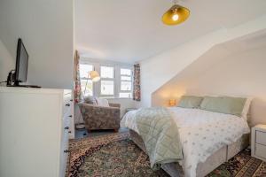 a bedroom with a bed and a tv and a chair at 2 Bed in Moffat oc-a32121 in Moffat