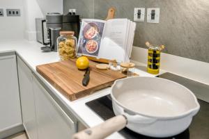 a kitchen counter with a bowl on a cutting board at 1 Bed in Backbarrow oc-s32477 in Backbarrow +13 photos