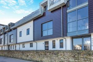 an exterior view of a building with windows at 2 Bed in West Bay oc-d31037 in West Bay