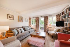 a living room with a couch and a table at 4 Bed in Barham oc-ct016 in Barham