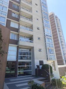 an apartment building with the front door open at Valparaiso01 in Valparaíso