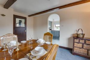 a dining room with a wooden table and chairs at 4 Bed in Hawes oc-ds940 in Hawes
