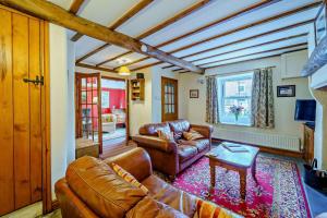 a living room with a couch and a table at 3 Bed in Hawes oc-hhmy23 in Hawes
