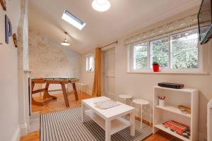 a living room with a table and a pool table at 2 Bed in Pickering oc-y110 in Pickering
