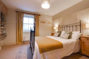 a bedroom with a large bed and a window at 2 Bed in Pickering oc-y110 in Pickering