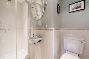 a bathroom with a toilet and a sink and a shower at 4 Bed in Arkengarthdale oc-h27492 in Low Eskcleth +27 photos