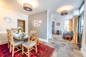 a dining room and living room with a table and chairs at 3 Bed in Braunton oc-soufar in Braunton