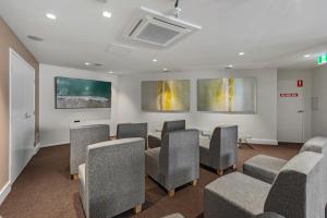 a conference room with chairs and a podium in it at Trilogy Surfers Paradise in Gold Coast +32 photos