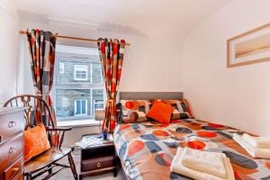 a bedroom with a bed and a window at 2 Bed in Burtersett oc-g28336 in Hawes