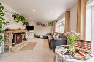 a living room with a couch and a fireplace at 3 Bed in Timsbury oc-h29584 in Timsbury