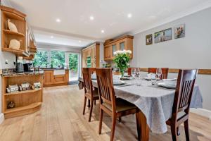 a kitchen and dining room with a table and chairs at 3 Bed in Timsbury oc-h29584 in Timsbury